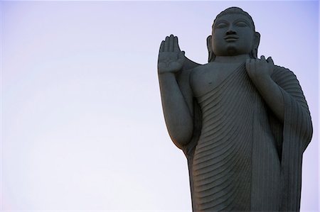 Vue d'angle faible d'une statue de Bouddha, Hussain Sagar, Hyderabad, Andhra Pradesh, Inde Photographie de stock - Rights-Managed, Code: 857-03192736