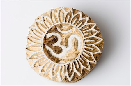 Om symbol engraved on wood Fotografie stock - Rights-Managed, Codice: 857-03192855