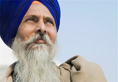 sikhism traditional clothing - Close-up of a Sikh man thinking, Amritsar, Punjab, India Stock Photo - Rights-Managed, Code: 857-03192897