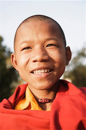Close-up of a monk smiling, Mahabodhi Temple, Bodhgaya, Gaya, Bihar, India Stock Photo - Rights-Managed, Code: 857-03192927