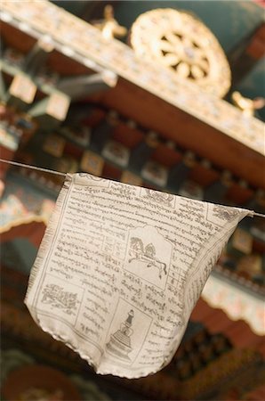 Low angle view of a prayer flag outside a temple, Bhutan Temple, Bodhgaya, Gaya, Bihar, India Stock Photo - Rights-Managed, Code: 857-03192986