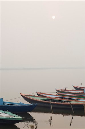 Boats moored in a river, Ganges River, Varanasi, Uttar Pradesh, India Stock Photo - Rights-Managed, Code: 857-03193018