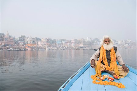 sadhu - Sadhu sitting in a boat and praying, Ganges River, Varanasi, Uttar Pradesh, India Stock Photo - Rights-Managed, Code: 857-03193011