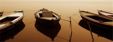 Boats moored in a river, Ganges River, Varanasi, Uttar Pradesh, India Stock Photo - Rights-Managed, Code: 857-03193020