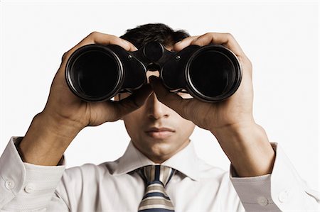 sorveglianza - Businessman looking through binoculars Foto de stock - Con derechos protegidos, Código: 857-03554045