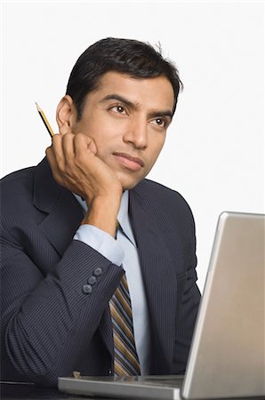 Close-up of a businessman day dreaming Stock Photo - Rights-Managed, Code: 857-03554049