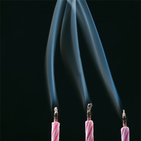 Smoke trailing from extinguished candles Stock Photo - Rights-Managed, Code: 857-03554076