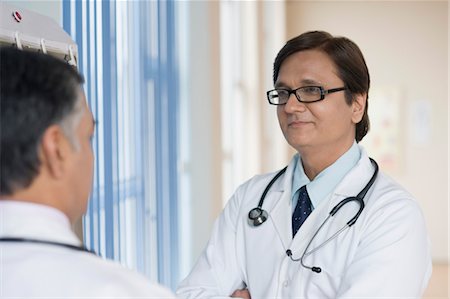 stethoscope check up indian photos - Doctors discussing, Gurgaon, Haryana, India Stock Photo - Rights-Managed, Code: 857-03554129