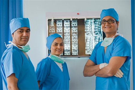 doctor team portrait - Three surgeons smiling in a hospital, Gurgaon, Haryana, India Stock Photo - Rights-Managed, Code: 857-03554166