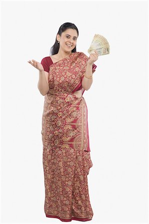 sari - Woman holding currency notes Stock Photo - Rights-Managed, Code: 857-03554286