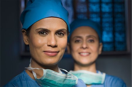 Portrait of two female surgeons smiling, Gurgaon, Haryana, India Stock Photo - Rights-Managed, Code: 857-03554302