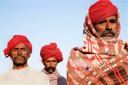 Portrait of three men, Pushkar Camel Fair, Pushkar, Rajasthan, India Fotografie stock - Rights-Managed, Codice: 857-03553527