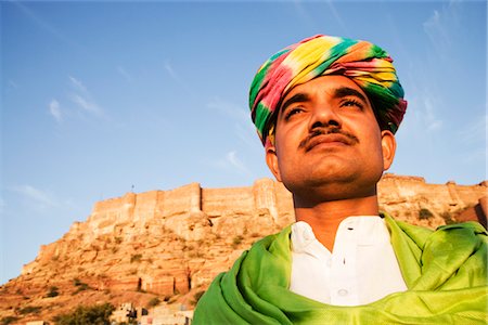 Man with fort in the background, Meherangarh Fort, Jodhpur, Rajasthan, India Stock Photo - Rights-Managed, Code: 857-03553555