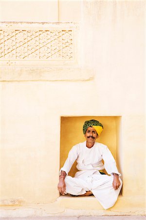 Man sitting in lotus position in a fort, Meherangarh Fort, Jodhpur, Rajasthan, India Foto de stock - Con derechos protegidos, Código: 857-03553572