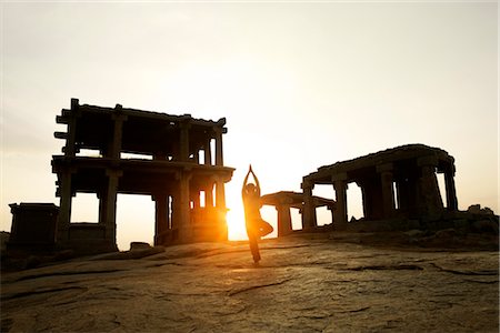 Silhouette of a person practicing yoga, Hampi, Karnataka, India Stock Photo - Rights-Managed, Code: 857-03553628