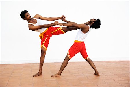 fighting to protect - Two people practicing kalarippayattu Stock Photo - Rights-Managed, Code: 857-03553636