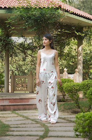 simsearch:862-07690078,k - Woman walking in a garden, New Delhi, India Stock Photo - Rights-Managed, Code: 857-03553777