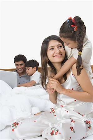 sleepwear - Family having fun on the bed Stock Photo - Rights-Managed, Code: 857-03553787