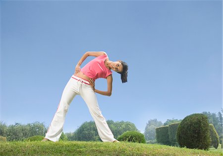 exercise indian women pic - Woman stretching in a park, Gurgaon, Haryana, India Stock Photo - Rights-Managed, Code: 857-03553808