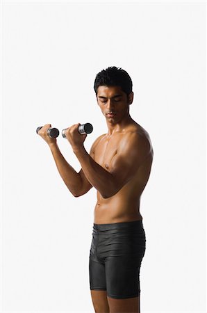 simsearch:630-06723325,k - Man exercising with dumbbells Stock Photo - Rights-Managed, Code: 857-03553907