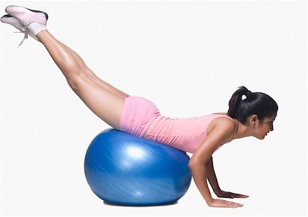 exercise indian women pic - Young woman exercising on a fitness ball Stock Photo - Rights-Managed, Code: 857-03553975