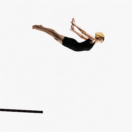 Young woman diving from a diving board Stock Photo - Rights-Managed, Code: 857-03553989