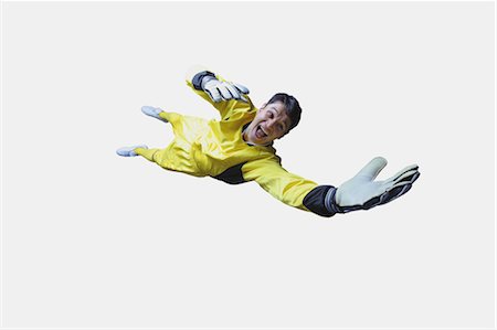 soccer goalie saves - Studio Shot of a Young Male Goal Keeper Stock Photo - Rights-Managed, Code: 858-05604609