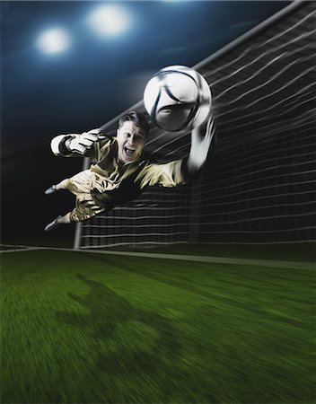 Young Goal Keeper Making a Save Fotografie stock - Rights-Managed, Codice: 858-05604665