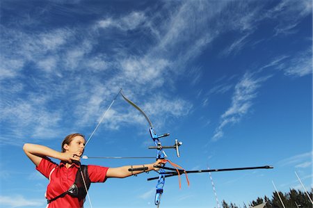 Young Female Archer Aiming at Target Stock Photo - Rights-Managed, Code: 858-05604909