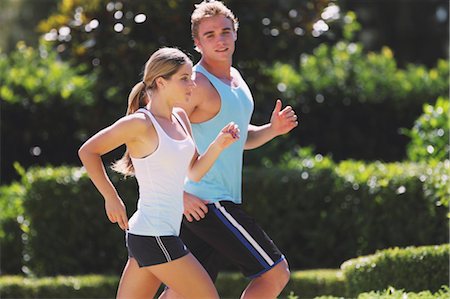 simsearch:858-05604777,k - Young Couples Jogging Outdoor in the Sunny Day Foto de stock - Con derechos protegidos, Código: 858-05605054