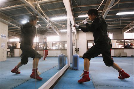 Boxer Practicing in Front of Mirror Stock Photo - Rights-Managed, Code: 858-05799235