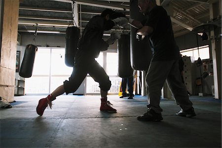 ethnicity fight - Trainer and Boxer Practicing Stock Photo - Rights-Managed, Code: 858-05799238