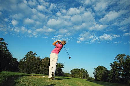 stroke (racket sports and golf) - Young Man Swinging Stock Photo - Rights-Managed, Code: 858-05799335