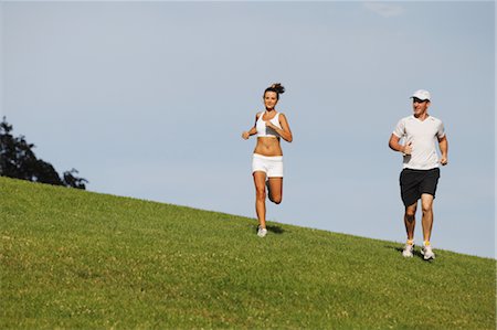 running frontal shorts man - Friends Jogging on Grass Stock Photo - Rights-Managed, Code: 858-05799359