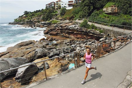 simsearch:858-05799389,k - Young Woman Running on Waterfront Stock Photo - Rights-Managed, Code: 858-05799396