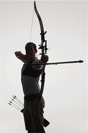 shooting arrow images - Archer Aiming With Gradient Background Stock Photo - Rights-Managed, Code: 858-06121552