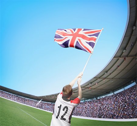 Homme au stade brandissant le drapeau britannique Photographie de stock - Rights-Managed, Code: 858-06159406
