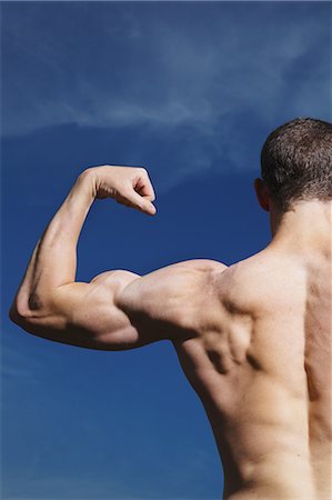 simsearch:858-06617627,k - Man Showing Muscles Fotografie stock - Rights-Managed, Codice: 858-06617628