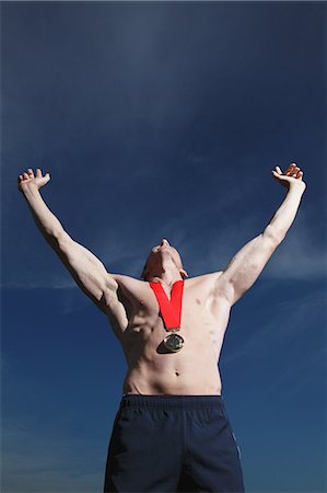 sports medal - Man Wearing a Gold Medal Stock Photo - Rights-Managed, Code: 858-06617637