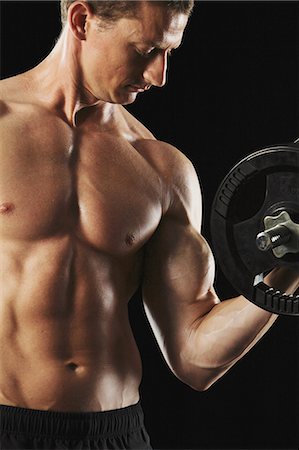 dumb bell in a gym - Man Working Out Stock Photo - Rights-Managed, Code: 858-06617655