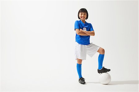 sports uniform - Girl Posing In Soccer Uniform With Ball Stock Photo - Rights-Managed, Code: 858-06617685