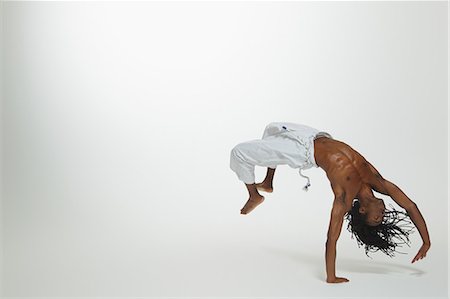 Man Practicing Capoeira Foto de stock - Con derechos protegidos, Código: 858-06617794