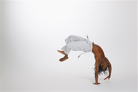 Man Practicing Capoeira Stock Photo - Rights-Managed, Code: 858-06617793