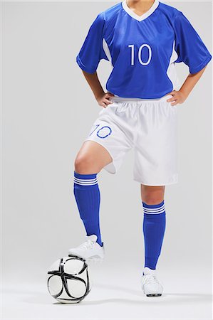 studio shot - Woman In Soccer Uniform Posing With Ball Stock Photo - Rights-Managed, Code: 858-06617812