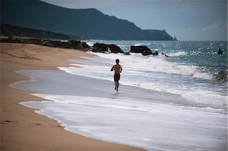 Young Man Running On The Beach Stock Photo - Rights-Managed, Code: 858-06756014