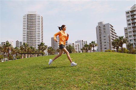 simsearch:858-06756054,k - Woman Running On Grass Stock Photo - Rights-Managed, Code: 858-06756065