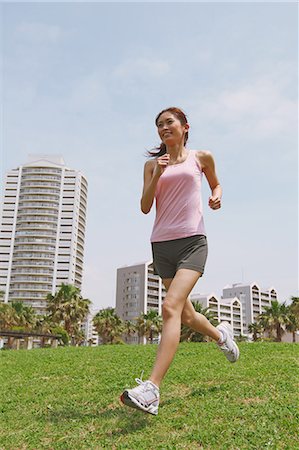 simsearch:858-06756054,k - Woman Running On Grass Stock Photo - Rights-Managed, Code: 858-06756072