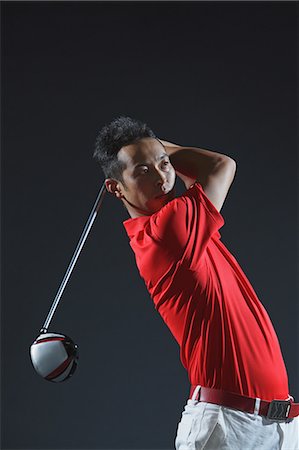 simsearch:6116-07236040,k - Golfer Swinging Golf Club Photographie de stock - Rights-Managed, Code: 858-06756120