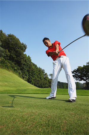 simsearch:6113-07159318,k - Golfer Swinging After Tee Off Stock Photo - Rights-Managed, Code: 858-06756157