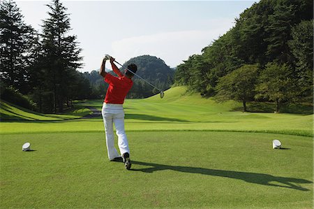 simsearch:858-05799334,k - Golfer Swinging Club Foto de stock - Con derechos protegidos, Código: 858-06756160